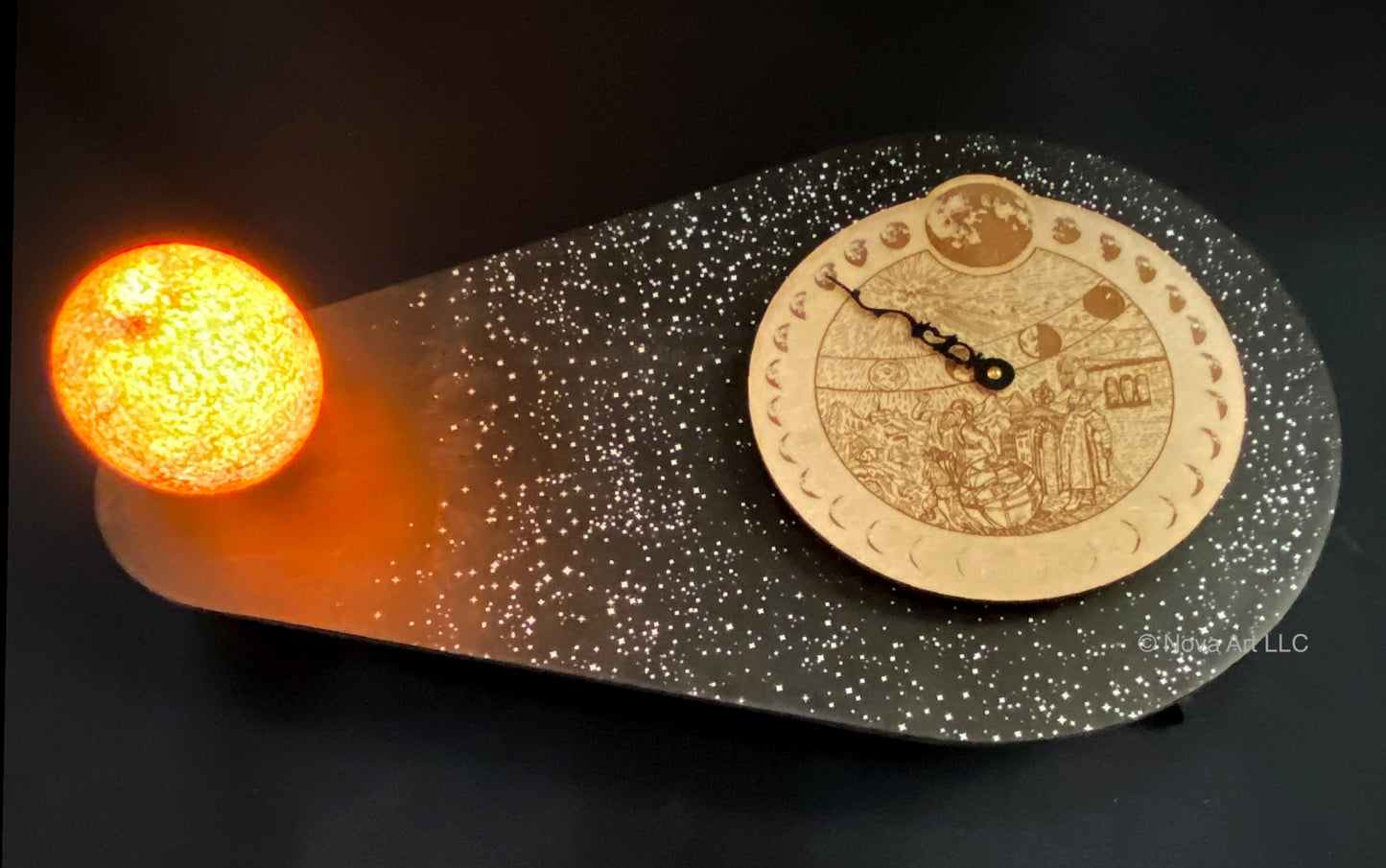 The Luna Sol moon phase clock is a true 29.5 day synodic lunar period. It demonstrates the correct current phases of the Moon throughout its cycle. A clock hand points to the Moon's phases throughout the month.
The Moon face is a beautiful engraved woodcut