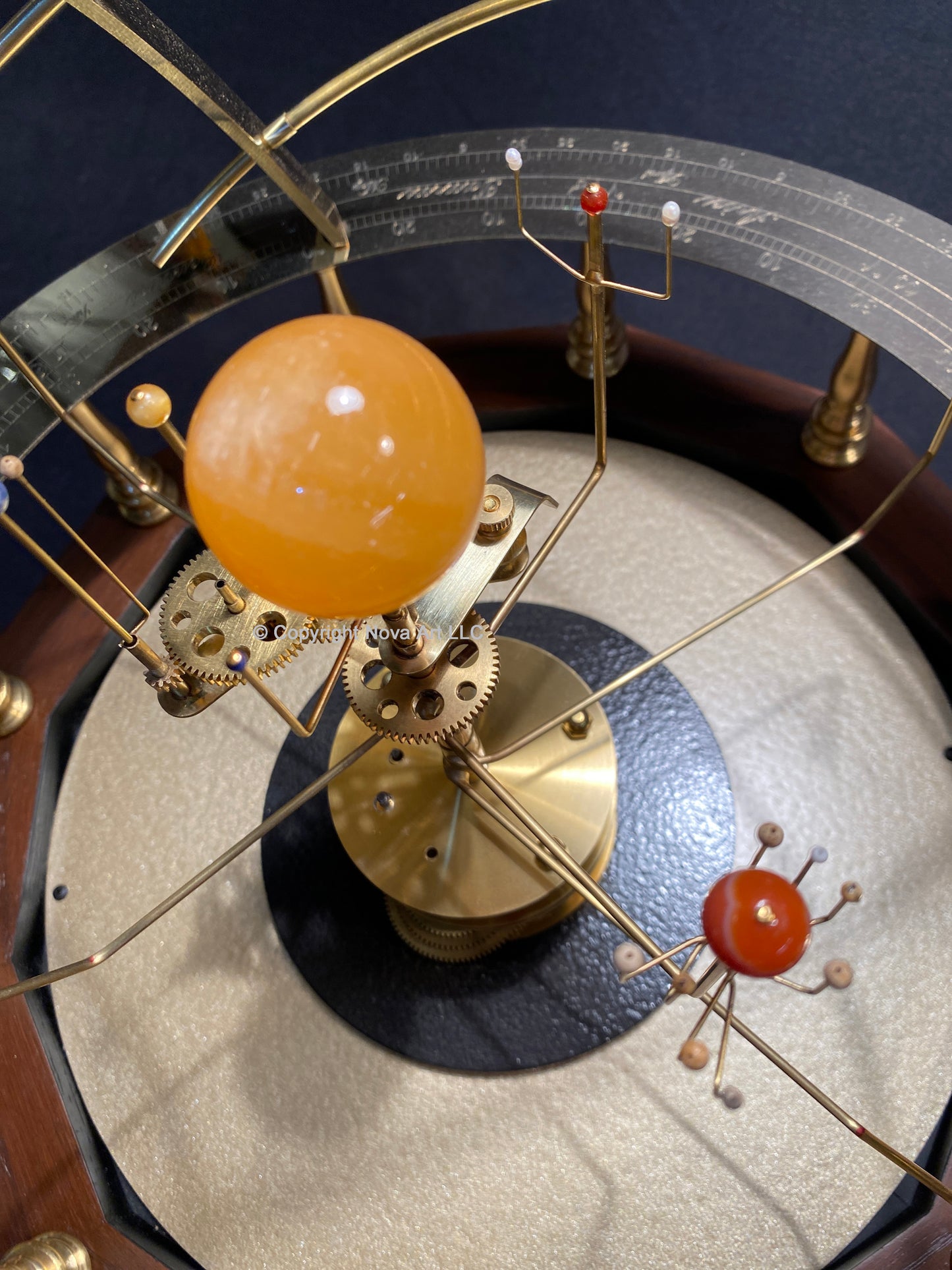 Semi-precious stone planets and moons on Baby Grand Orrery solar system model made by Science Art