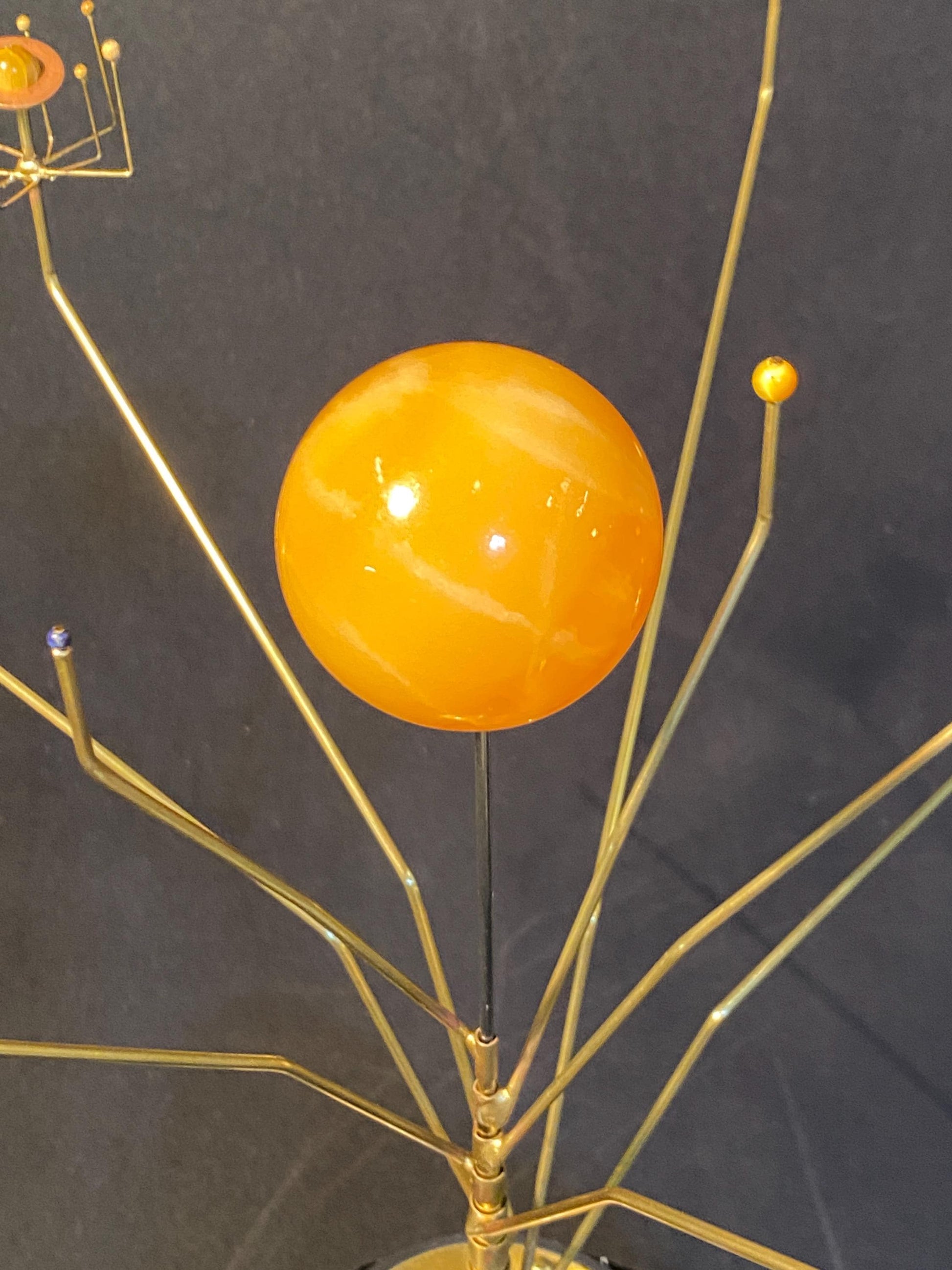 Close up of the Sun depicted as an orange calcite sphere.