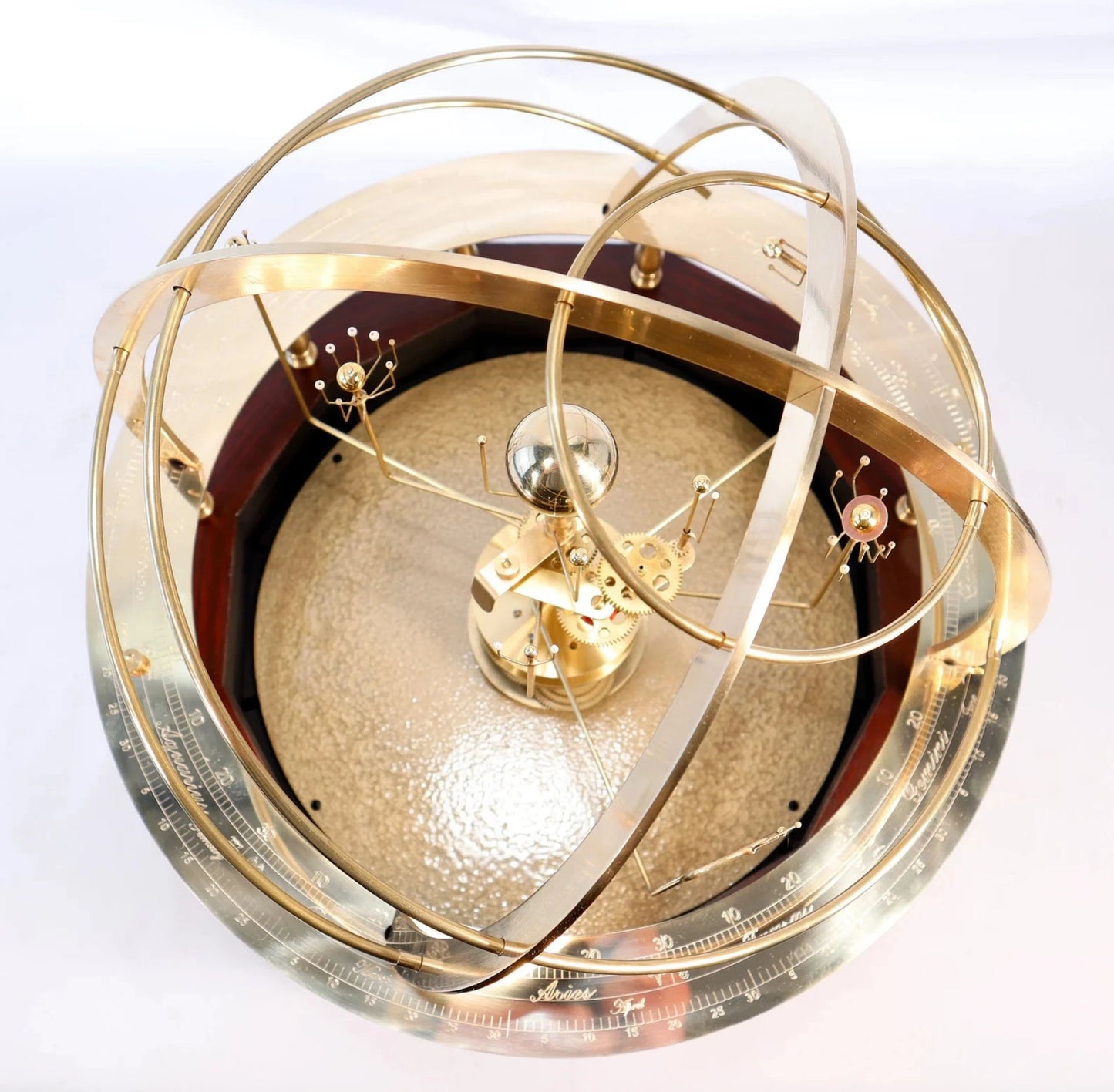 overhead view of grand orrery in brass from science art